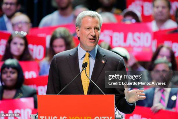 New York City Mayor Bill de Blasio speaks to attendees during a campaign rally with Sen. Bernie Sanders on October 30, 2017 in New York City. New...