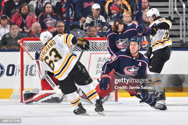 Brad Marchand of the Boston Bruins scores his 200th career NHL goal on goaltender Sergei Bobrovsky of the Columbus Blue Jackets during the third...