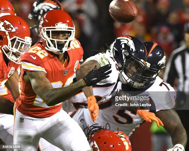 Kansas City Chiefs cornerback Marcus Peters strips the ball from Denver Broncos running back Jamaal Charles during the first quarter on October 30,...
