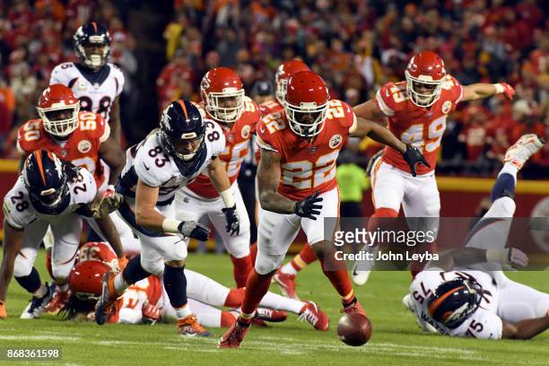 Kansas City Chiefs cornerback Marcus Peters picks up the loose ball after stripping the ball from Denver Broncos running back Jamaal Charles during...