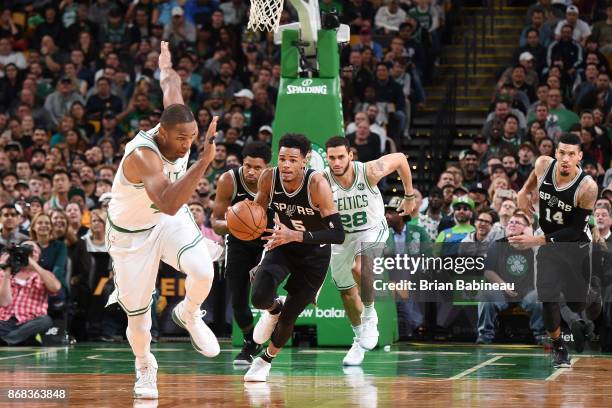 Dejounte Murray of the San Antonio Spurs handles the ball against the Boston Celtics on October 30, 2017 at the TD Garden in Boston, Massachusetts....