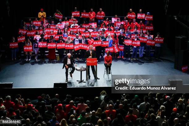 New York City Mayor Bill de Blasio speaks to supporters next to Sen. Bernie Sanders and the mayor's wife Chirlane McCray as they take part in a...