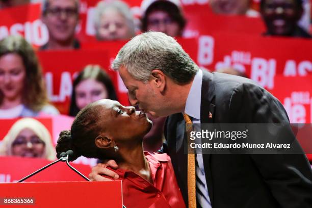 New York City Mayor Bill de Blasio kisses his wife Chirlane McCray as they take part in a campaign rally on October 30, 2017 in New York City. New...