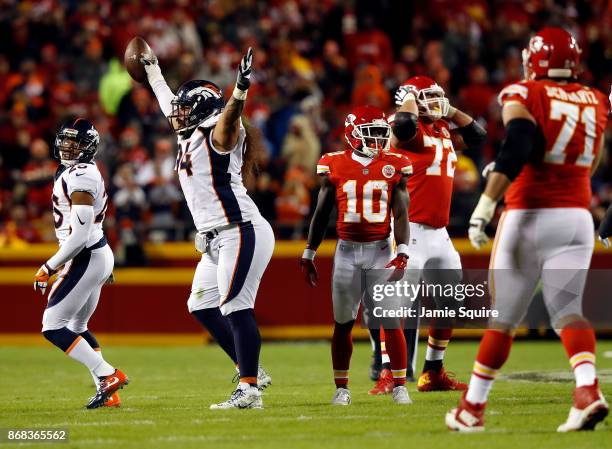 Nose tackle Domata Peko of the Denver Broncos celebrates after recovering a fumble during the game against the Kansas City Chiefs at Arrowhead...