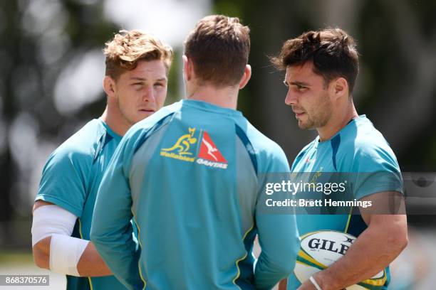 Michael Hooper, Bernard Foley and Nick Phipps speak during the Australian Wallabies training session at Leichhardt Oval on October 31, 2017 in...