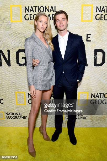 Abby Champion and Patrick Schwarzenegger attend the premiere of National Geographic's "The Long Road Home" at Royce Hall on October 30, 2017 in Los...