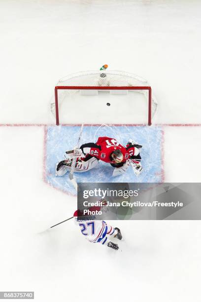 Alex Galchenyuk of the Montreal Canadiens shoots the puck past Craig Anderson of the Ottawa Senators in the second period at Canadian Tire Centre on...