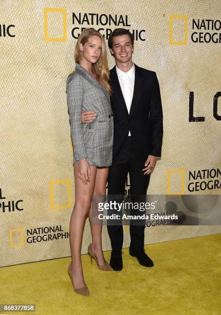 Model Abby Champion and actor Patrick Schwarzenegger arrive at the premiere of National Geographic's "The Long Road Home" at Royce Hall on October...