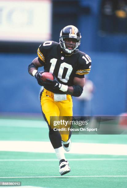 Kordell Stewart of the Pittsburgh Steelers runs with the ball during an NFL football game circa 1996 at Three Rivers Stadium in Pittsburgh,...