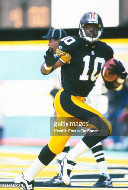 Kordell Stewart of the Pittsburgh Steelers runs with the ball during an NFL football game circa 1996 at Three Rivers Stadium in Pittsburgh,...
