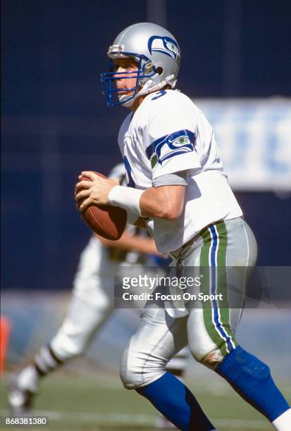 Rick Mirer of the Seattle Seahawks looks to pass the ball against the San Diego Chargers during an NFL football game September 10, 1995 at Jack...