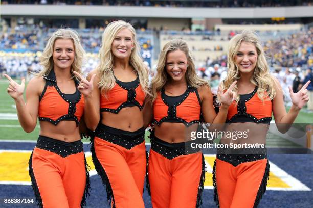 The Oklahoma State Poms on the field during the second quarter of the college football game between the Oklahoma State Cowboys and the West Virginia...