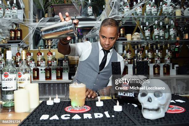 National Rum Ambassador Juan Coronado crafts a cocktail during BACARDI presents Dress To Be Free with performances by Cardi B and Les Twins at House...