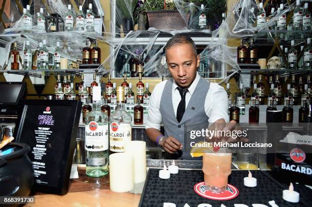 National Rum Ambassador Juan Coronado crafts a cocktail during BACARDI presents Dress To Be Free with performances by Cardi B and Les Twins at House...