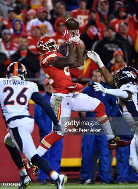 Tight end Demetrius Harris of the Kansas City Chiefs fails to catch a pass as free safety Darian Stewart of the Denver Broncos defends during the...