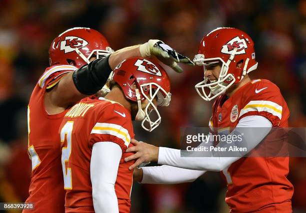 Kicker Harrison Butker of the Kansas City Chiefs is congratulaed by punter Dustin Colquitt and offensive tackle Eric Fisher after making a field goal...