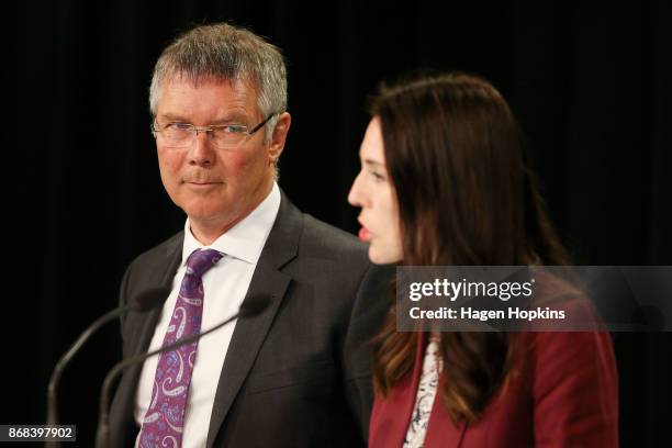 Prime Minister Jacinda Ardern speaks while Minister for Economic Development David Parker looks on during a post cabinet press conference at...