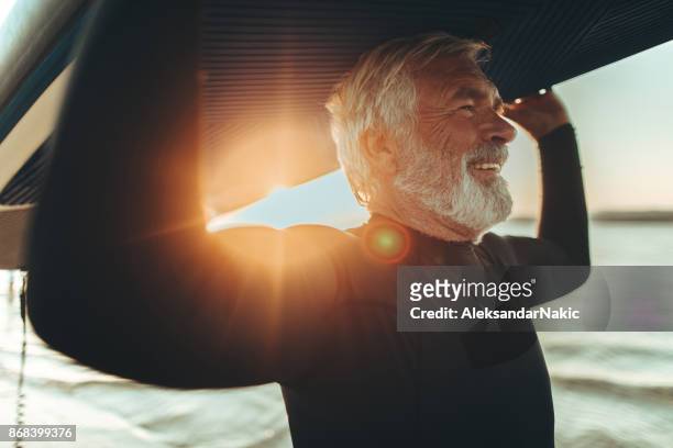 senior surfer - baby boomer stock pictures, royalty-free photos & images
