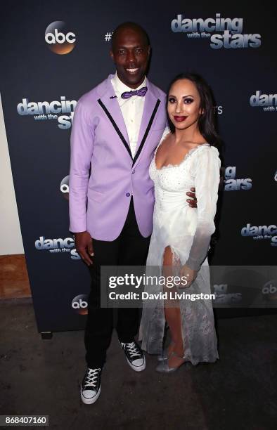 Former NFL player Terrell Owens and dancer Cheryl Burke pose at "Dancing with the Stars" season 25 at CBS Televison City on October 30, 2017 in Los...
