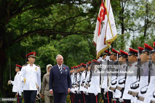 Prince Charles, Prince of Wales inspects the guard of honour, accompanied by Singapore President, Halimah Yacob during the welcome ceremony at the...