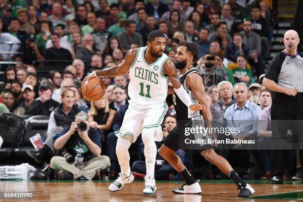 Kyrie Irving of the Boston Celtics handles the ball against the San Antonio Spurs on October 30, 2017 at the TD Garden in Boston, Massachusetts. NOTE...