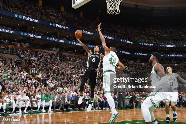 Dejounte Murray of the San Antonio Spurs shoots the ball against the Boston Celtics on October 30, 2017 at the TD Garden in Boston, Massachusetts....