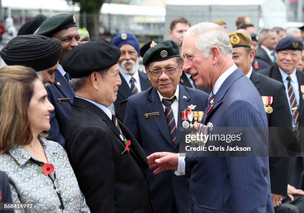Prince Charles, Prince of Wales shakes hands and speaks with veterans after a memorial ceremony at The Cenotaph war memorial on October31, 2017 in...