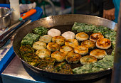 Fried chives dumplings on night street food Thailand