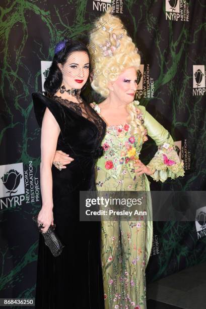 Dita Von Teese and Bette Midler attend Bette Midler's 2017 Hulaween Event Benefiting The New York Restoration Project at Cathedral of St. John the...