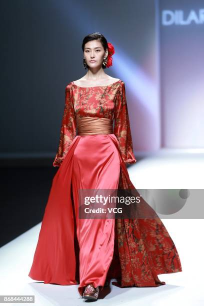 Model showcases designs on the runway at the Dilara Zakir collection show during the Mercedes-Benz China Fashion Week Spring/Summer 2018 at the...