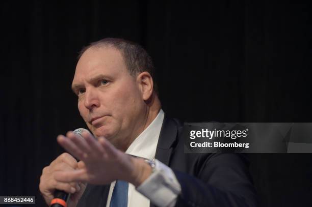 Nev Power, chief executive officer of Fortescue Metals Group Ltd., gestures as he speaks during the International Mining And Resources Conference in...
