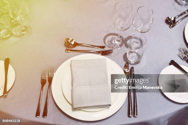 restaurant table setting - round table with table cloth stock pictures, royalty-free photos & images