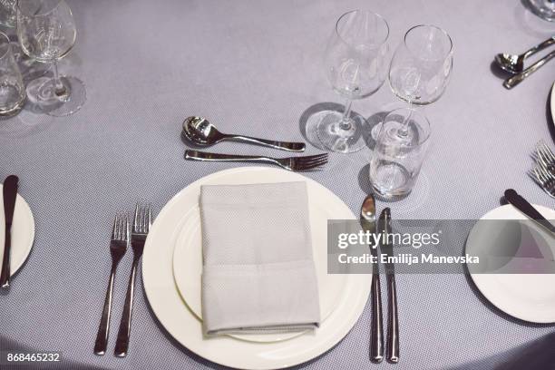 restaurant table setting - round table with table cloth stock pictures, royalty-free photos & images
