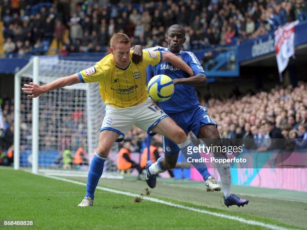 Adam Rooney of Birmingham City and Ramires of Chelsea in action during a FA Cup 5th Round match at Stamford Bridge on February 18, 2012 in London,...