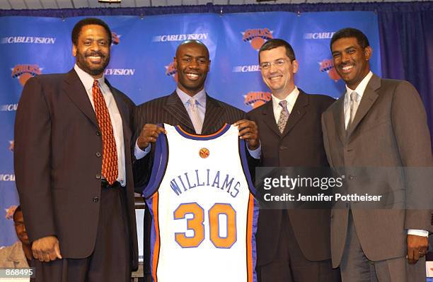 Knicks Head Coach Don Chaney, Frank Williams, Knicks president Scott Layden and MSG Sports president Steve Mills attend a press conference during the...