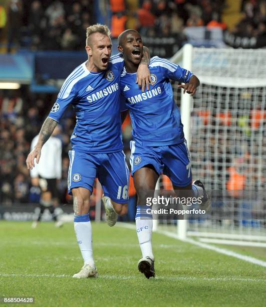 December 06: Ramires of Chelsea celebrates after scoring with teammate Raul Meireles during the UEFA Champions League match between Chelsea and...