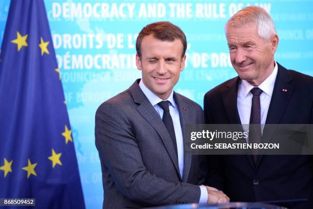 French President Emmanuel Macron shakes hands with Secretary General of the Council of Europe Thorbjorn Jagland upon his arrival at the Council of...