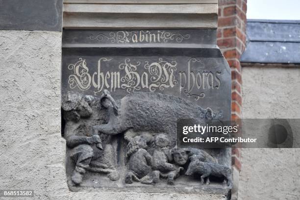 Medieval anti-Semitic carving depicting Jews suckling the teats of a sow as a rabbi looks intently under its leg and tail is pictured at the...