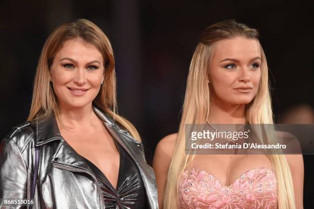 Eva Henger and Mercedes Schicchi walk a red carpet for 'Good Food' during the 12th Rome Film Fest at Auditorium Parco Della Musica on October 30,...