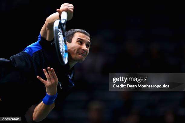 Evgeny Donskoy of Russia serves against Kyle Edmund of Great Britain during Day 2 of the Rolex Paris Masters held at the AccorHotels Arena on October...