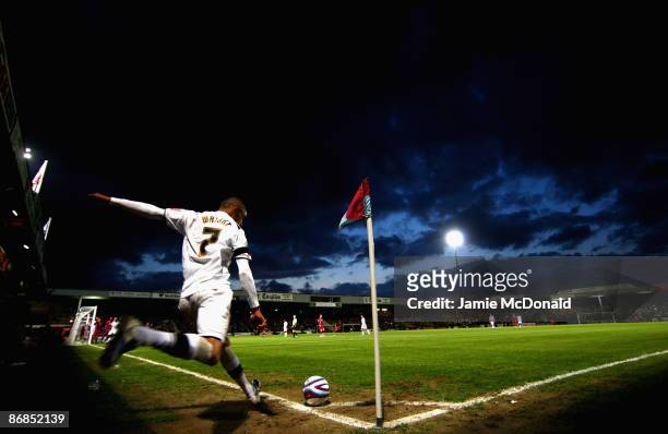 Mark Wright of the MK Dons takes a corner during the Coca-Cola Football League One play off semi-final, first leg match between Scunthorpe United and...