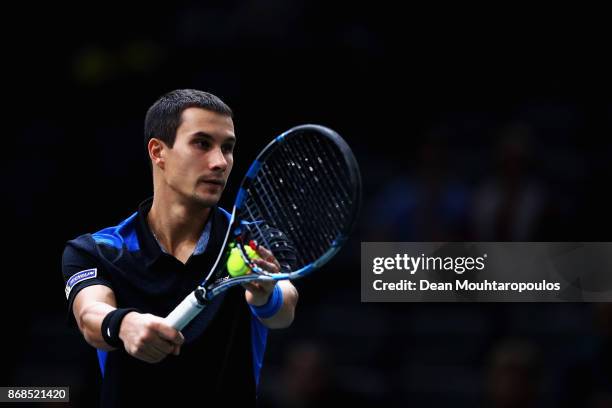 Evgeny Donskoy of Russia serves against Kyle Edmund of Great Britain during Day 2 of the Rolex Paris Masters held at the AccorHotels Arena on October...