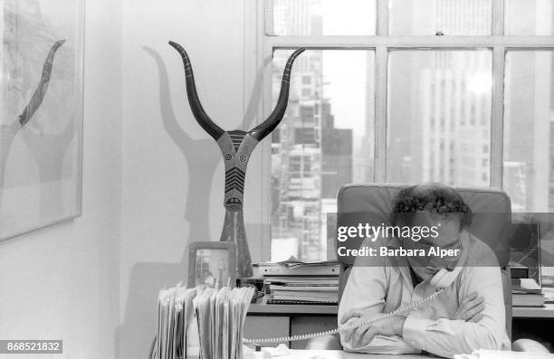 American film producer Bob Weinstein on the phone at Miramax offices in New York City, 21st April 1989..