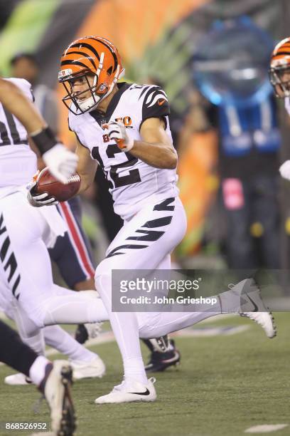 Alex Erickson of the Cincinnati Bengals runs the football upfield during the game against the Houston Texans at Paul Brown Stadium on September 14,...