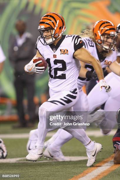 Alex Erickson of the Cincinnati Bengals runs the football upfield during the game against the Houston Texans at Paul Brown Stadium on September 14,...