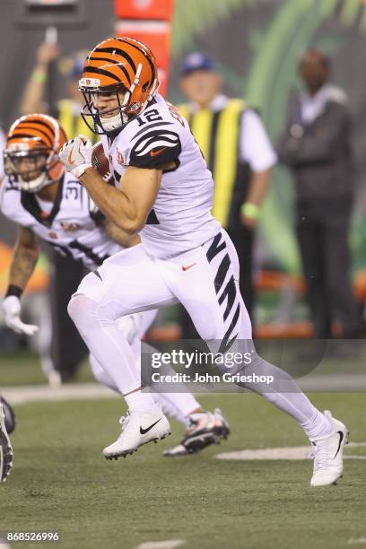 Alex Erickson of the Cincinnati Bengals runs the football upfield during the game against the Houston Texans at Paul Brown Stadium on September 14,...