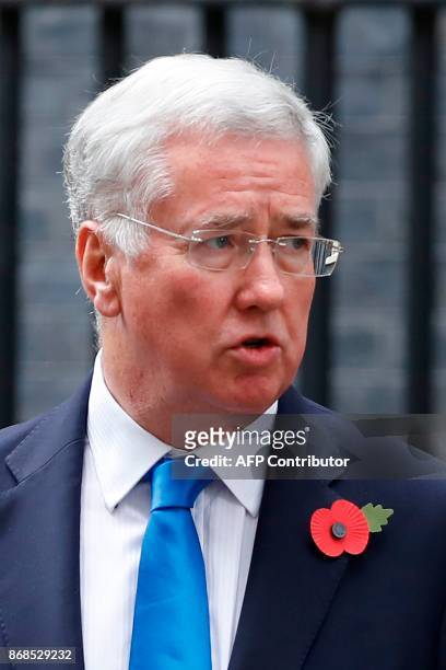 Britain's Defence Secretary Michael Fallon leaves 10 Downing Street after the weekly meeting of the cabinet in central London on October 31, 2017. /...