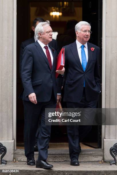 Defence secretary Michael Fallon and Brexit Secretary David Davis leave after attending a cabinet meeting in Downing Street on October 31, 2017 in...