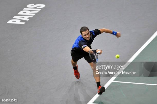 Evgeny Donskoy of Russia plays a forehand in the men's singles first round match against Kyle Edmund of Great Britain during day two of the Rolex...