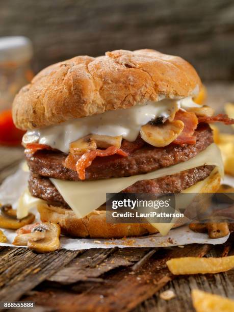 Mushroom Bacon Swiss Burger With Blue Cheese Dressing High-Res Stock Photo